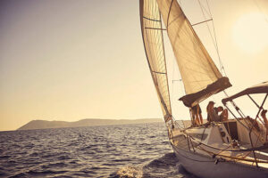 Shot of a young couple spending time together on a yacht